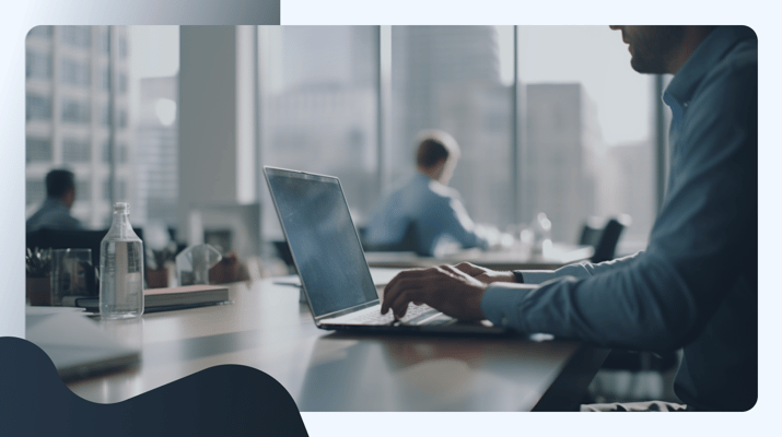 A real photo of a person typing on a laptop. a digital marketing specialist, sitting at a desk in a modern office